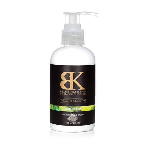 An image of Smooth & Soothe intimate shave cream in a squat bottle with a pump cap. The label reads White Tea Pear on a green strip with images of pears and leaves.